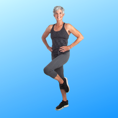 Woman standing on one leg with hands on hips