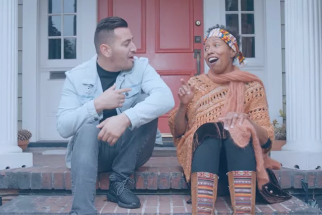 Man and woman visiting while sitting at doorstep