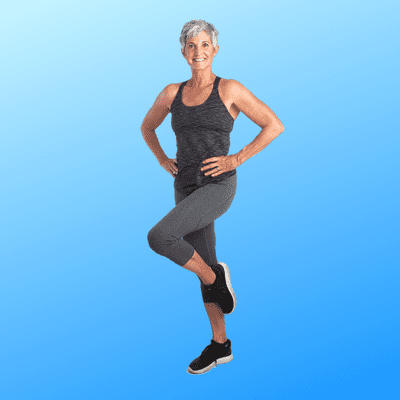 Woman posed with hands on hips and standing on one leg