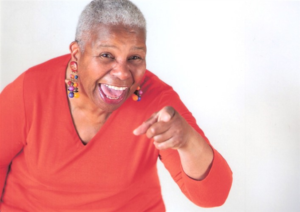 Mature African American woman in red sweater
