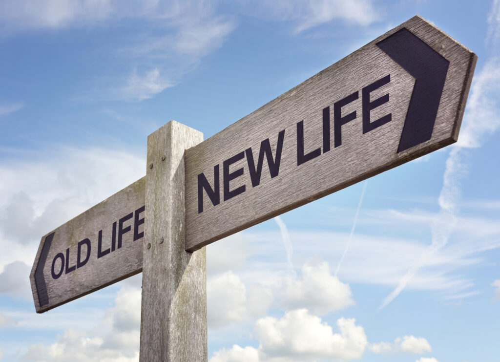 directional sign that says old life new life