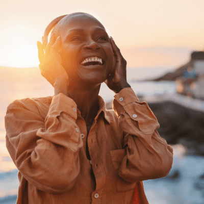 Beautiful sunset, woman listening to headphones