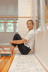 Katie sitting on floor of loft area