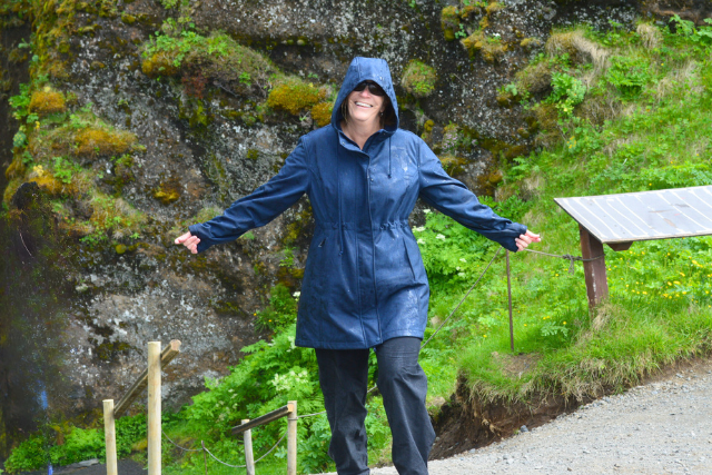 Nancy, woman with raincoat on nature path