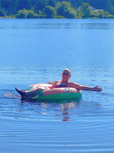 woman on floaty in a lake