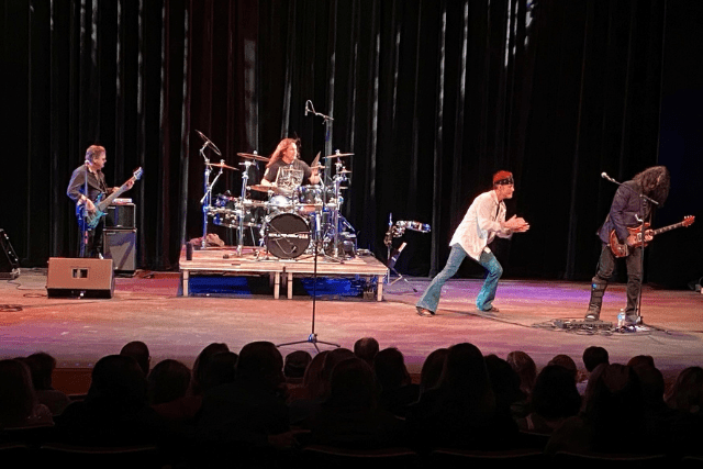 Journey cover band on performance stage